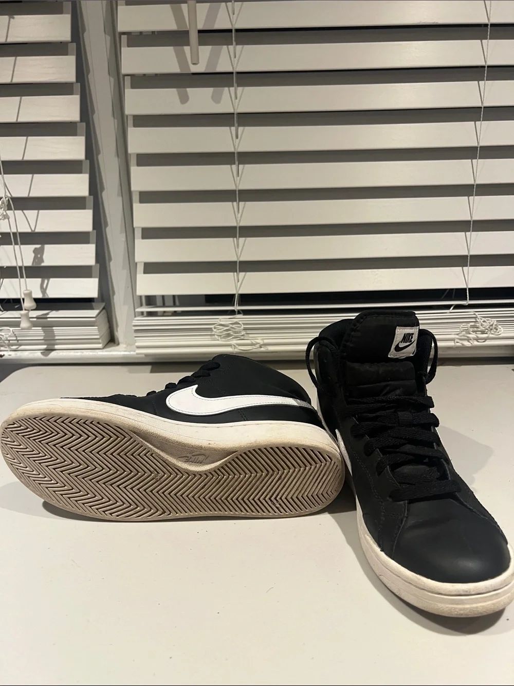 Nike Black High-Top Sneakers with White Soles and White Tongue Logo